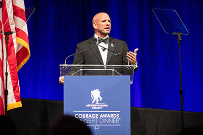 Warrior Dan Nevins speaks to the attendees at WWP's Courage Awards and Benefits Dinner.